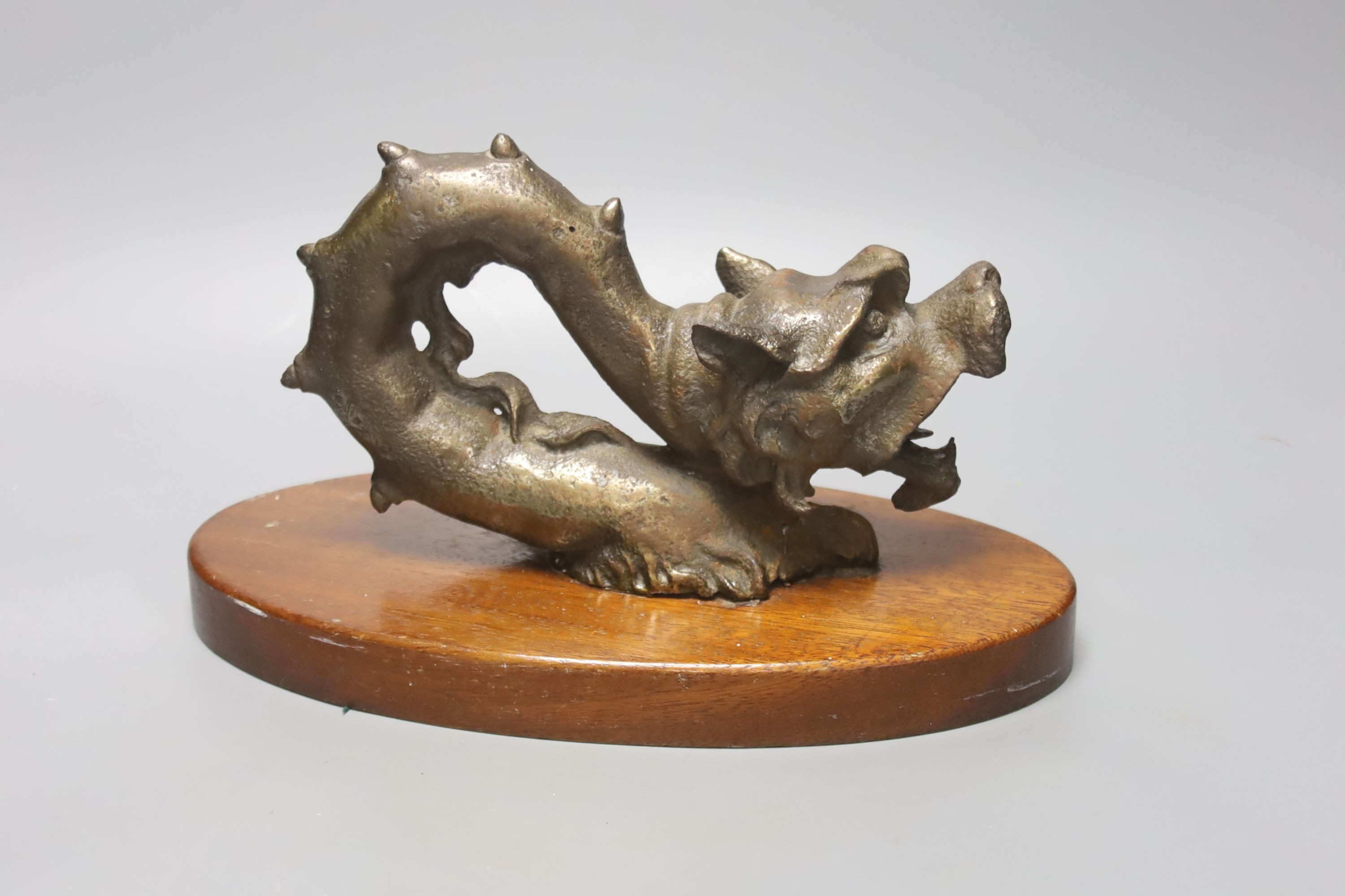 An Indonesian bronze dragon, on stand, height 17cm
